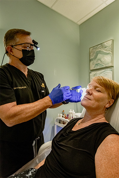 staff member injecting botox to client